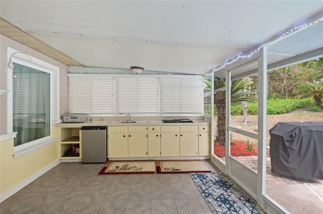 sunroom with a sink