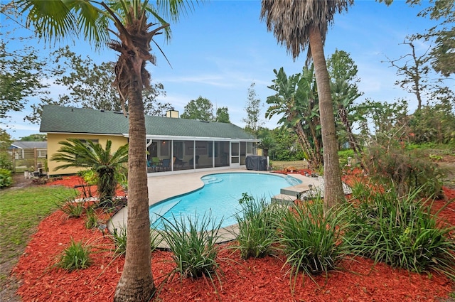 pool featuring a sunroom