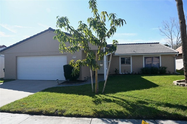 ranch-style house featuring a garage, a tile roof, driveway, stucco siding, and a front yard