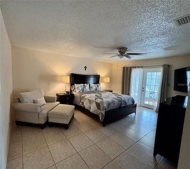 bedroom with access to exterior, visible vents, a ceiling fan, and light tile patterned flooring