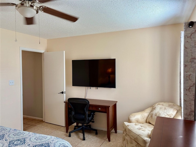 bedroom with ceiling fan, a textured ceiling, and light tile patterned floors