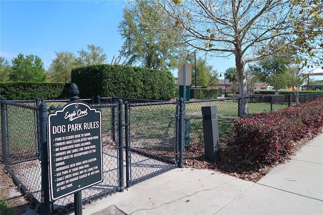 view of gate with fence