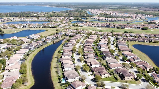 bird's eye view with a residential view and a water view