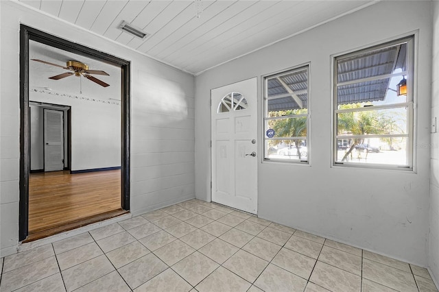 entrance foyer with wooden ceiling, visible vents, ceiling fan, and light tile patterned flooring