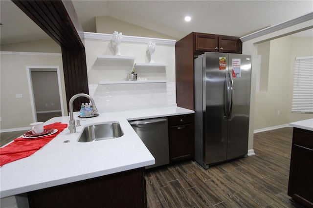 kitchen featuring dark wood-style flooring, open shelves, stainless steel appliances, lofted ceiling, and a sink