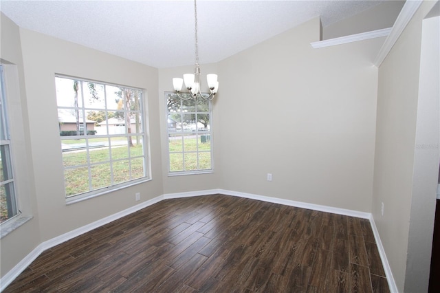 unfurnished dining area with baseboards, dark wood-type flooring, plenty of natural light, and an inviting chandelier