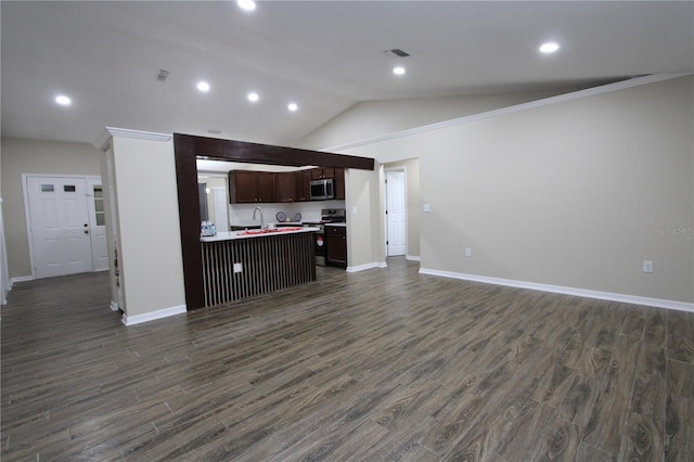 kitchen with dark wood finished floors, lofted ceiling, stainless steel microwave, open floor plan, and range