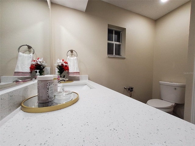 bathroom featuring a sink and toilet