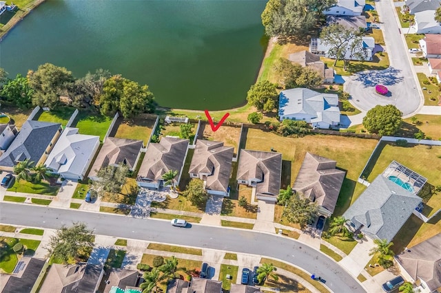 bird's eye view with a water view and a residential view