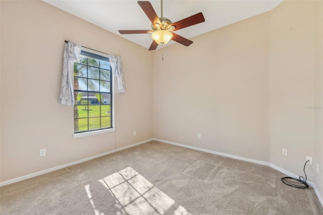 unfurnished room with ceiling fan, baseboards, and light colored carpet