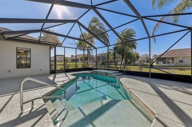 view of swimming pool with glass enclosure, a pool with connected hot tub, a patio area, and a residential view