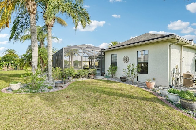 12018 SE 175th Loop, Summerfield, FL 34491 - rear view of house featuring stucco siding, a yard, and glass enclosure