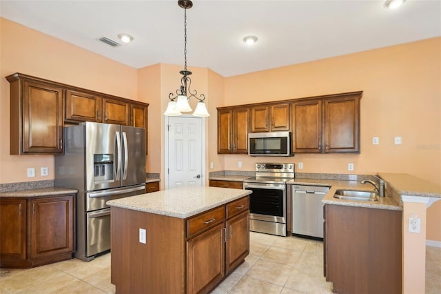 12018 SE 175th Loop, Summerfield, FL 34491 - kitchen featuring appliances with stainless steel finishes, a sink, a peninsula, light stone counters, and light tile patterned flooring