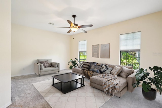12018 SE 175th Loop, Summerfield, FL 34491 - living room with light carpet, a ceiling fan, and baseboards