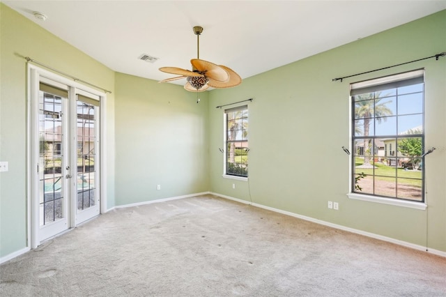 12018 SE 175th Loop, Summerfield, FL 34491 - carpeted spare room with ceiling fan, french doors, plenty of natural light, and baseboards