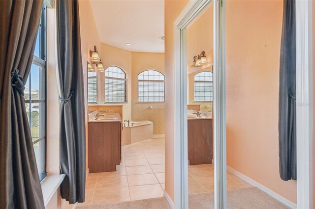 12018 SE 175th Loop, Summerfield, FL 34491 - full bathroom featuring tile patterned flooring, a garden tub, and vanity