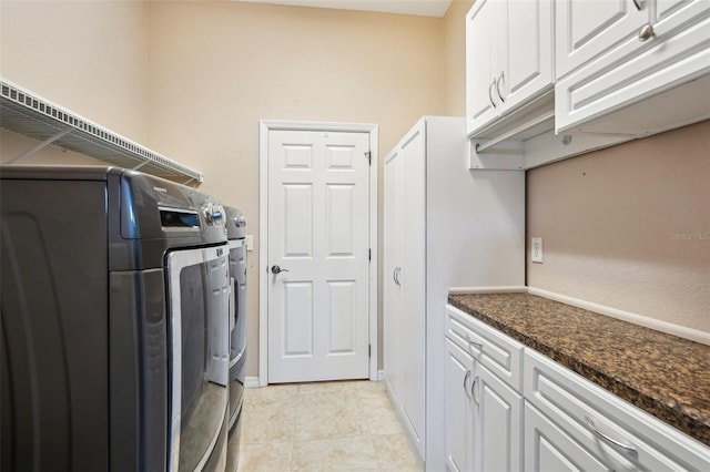 12018 SE 175th Loop, Summerfield, FL 34491 - laundry area featuring separate washer and dryer, cabinet space, and light tile patterned floors