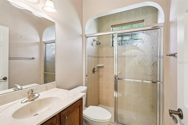 12018 SE 175th Loop, Summerfield, FL 34491 - full bathroom with toilet, vanity, and a shower stall