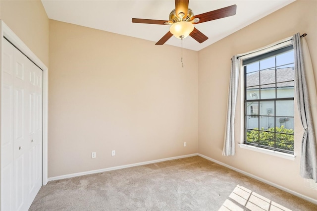 12018 SE 175th Loop, Summerfield, FL 34491 - unfurnished bedroom with light carpet, multiple windows, a closet, and baseboards