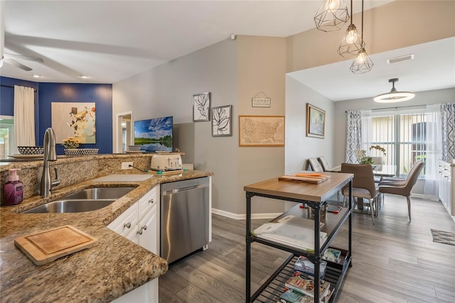 kitchen featuring dark wood-style floors, visible vents, white cabinets, a sink, and dishwasher