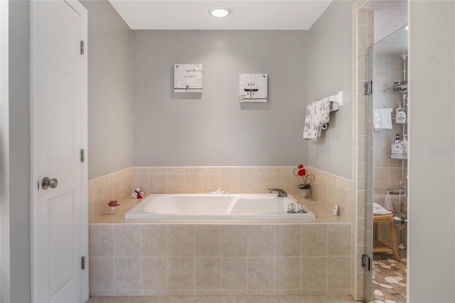 bathroom with a garden tub