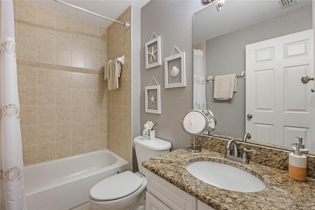 full bathroom featuring toilet, visible vents, shower / tub combo with curtain, and vanity