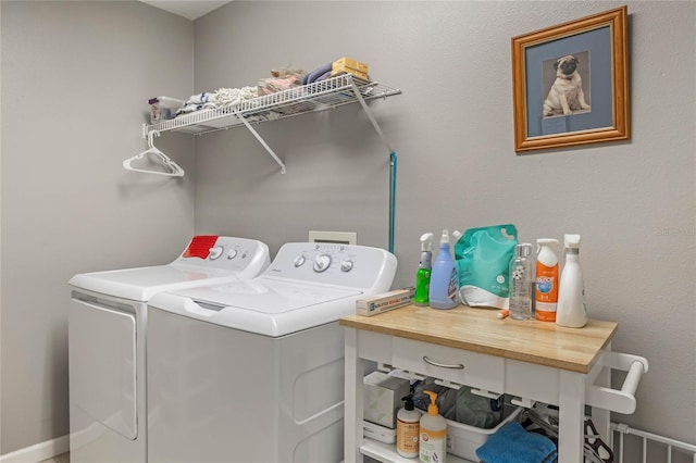 clothes washing area featuring laundry area and washing machine and clothes dryer