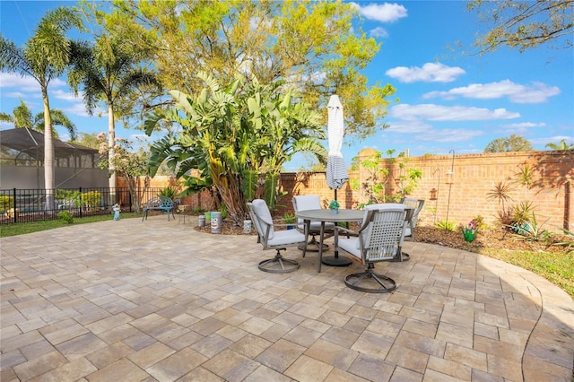 view of patio / terrace featuring outdoor dining space and a fenced backyard