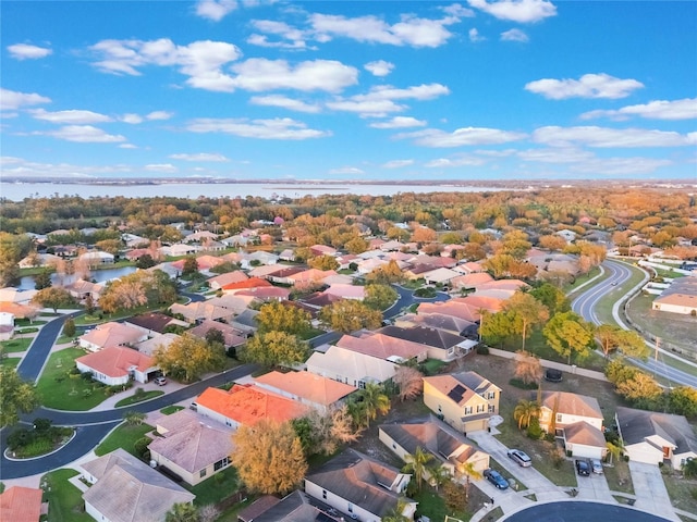 bird's eye view with a residential view and a water view