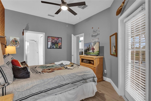 bedroom featuring a ceiling fan, light wood-type flooring, visible vents, and baseboards