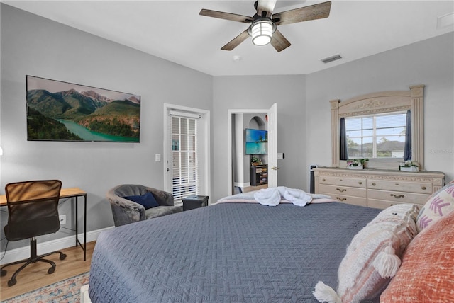 bedroom with baseboards, visible vents, ceiling fan, access to exterior, and light wood-style floors