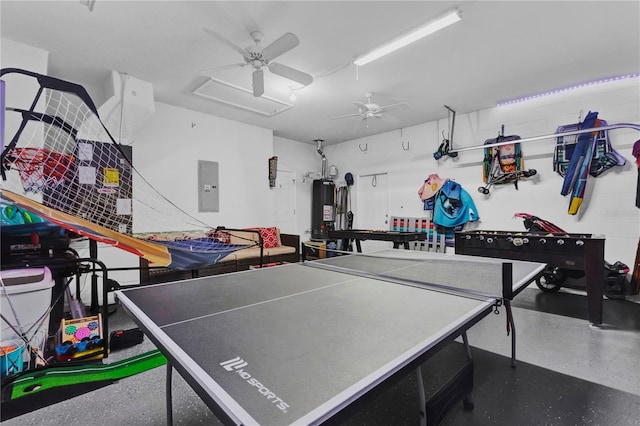 playroom featuring a ceiling fan, gas water heater, electric panel, and speckled floor