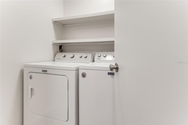 laundry area featuring washer and dryer and laundry area