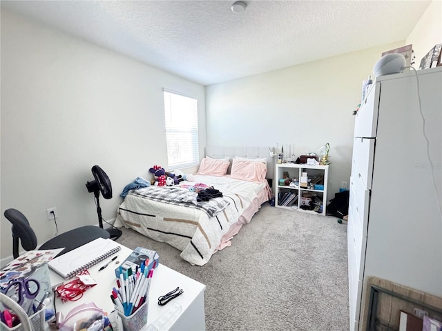 carpeted bedroom with a textured ceiling