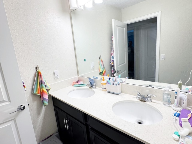 bathroom with double vanity and a sink