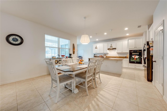 dining space with recessed lighting, visible vents, baseboards, and light tile patterned floors