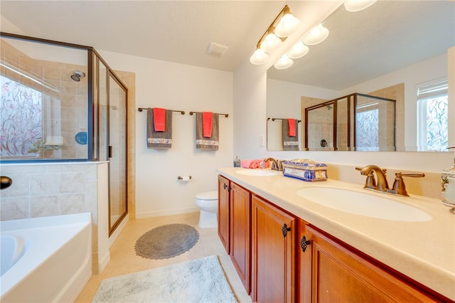 full bath with a garden tub, a sink, a shower stall, and tile patterned floors