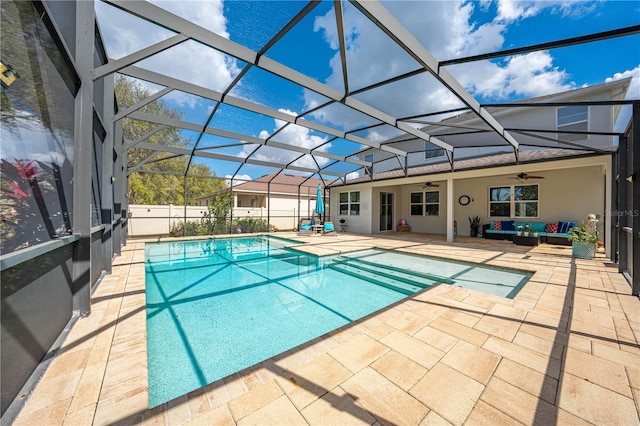 view of swimming pool featuring ceiling fan, a lanai, an outdoor living space, a fenced in pool, and a patio area