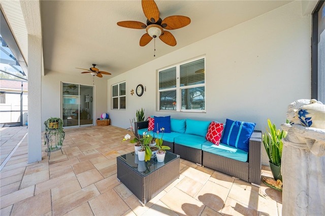 view of patio with a lanai, outdoor lounge area, and ceiling fan