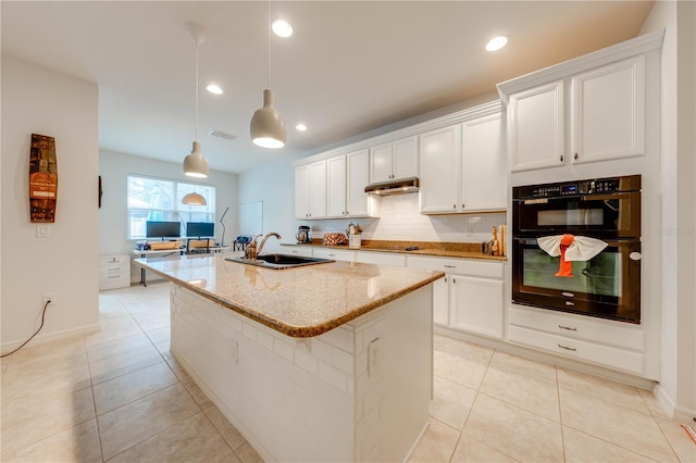 kitchen with light stone countertops, black appliances, a sink, and light tile patterned flooring