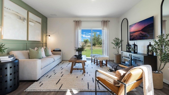 living room with dark wood-style floors and baseboards