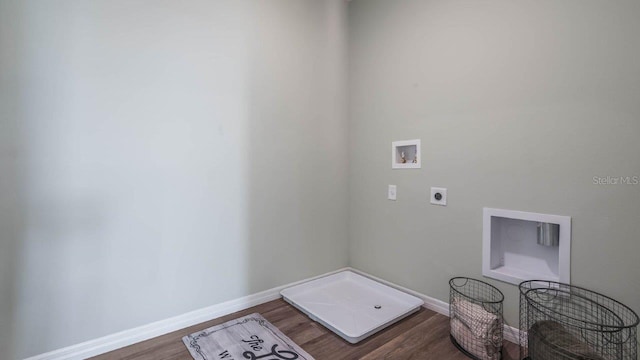 laundry area featuring laundry area, baseboards, dark wood-style flooring, hookup for a washing machine, and electric dryer hookup