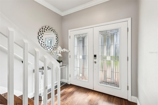 entryway featuring ornamental molding, french doors, dark wood finished floors, and baseboards