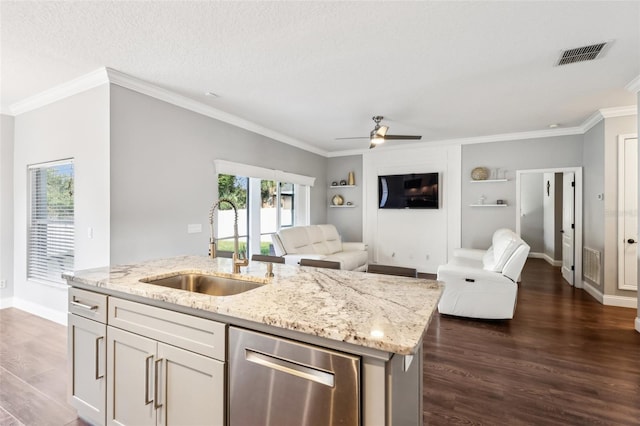 kitchen featuring visible vents, open floor plan, a sink, light stone countertops, and stainless steel dishwasher