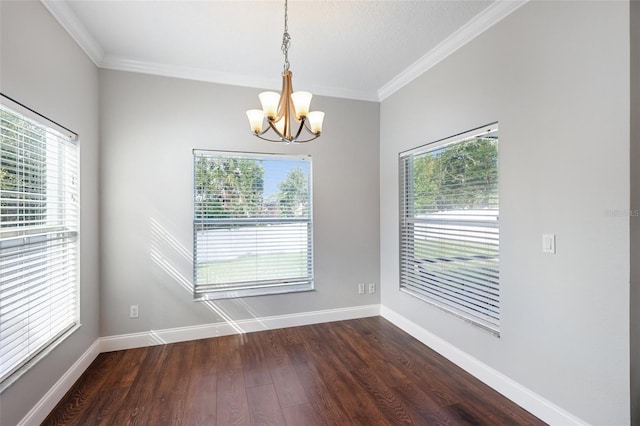 empty room with a healthy amount of sunlight, dark wood finished floors, and baseboards