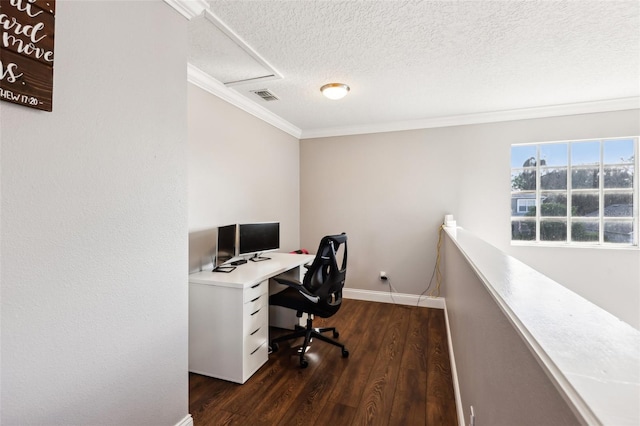 home office featuring a textured ceiling, dark wood-type flooring, visible vents, baseboards, and crown molding