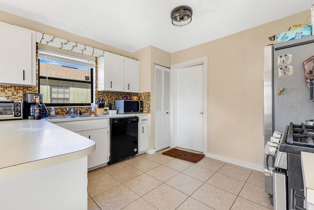 kitchen with black dishwasher, light countertops, tasteful backsplash, and white cabinets