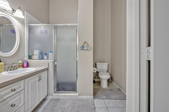 full bath with vanity, tile patterned flooring, toilet, and a shower stall