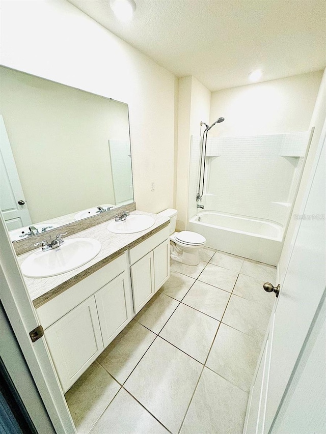 bathroom with toilet, tile patterned flooring, a sink, and shower / bathtub combination