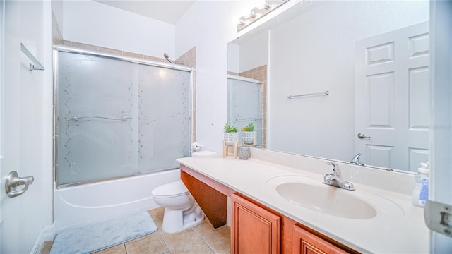 full bath with toilet, shower / bath combination with glass door, vanity, and tile patterned floors